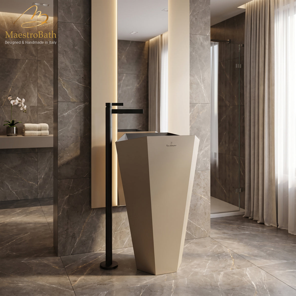 CASO freestanding bathroom faucet in black, floor mounted beside a faceted pedestal sink in a grey marble bathroom #color_black