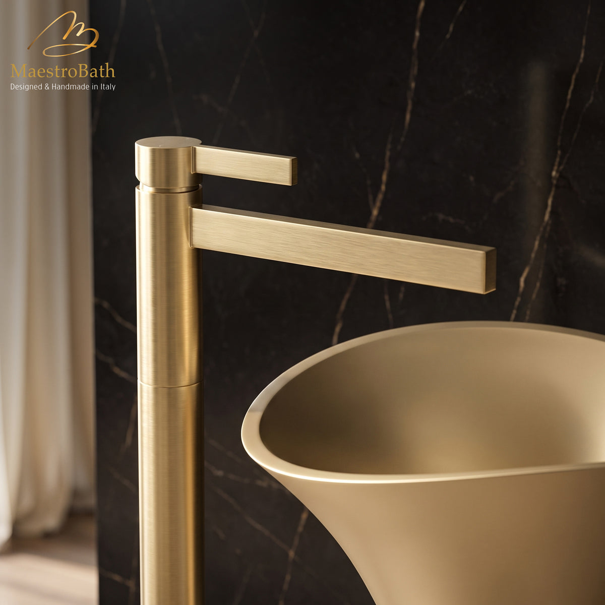 Close up of the brushed gold CASO faucet flat rectangular spout and single lever handle over a pedestal sink basin #color_brushed gold
