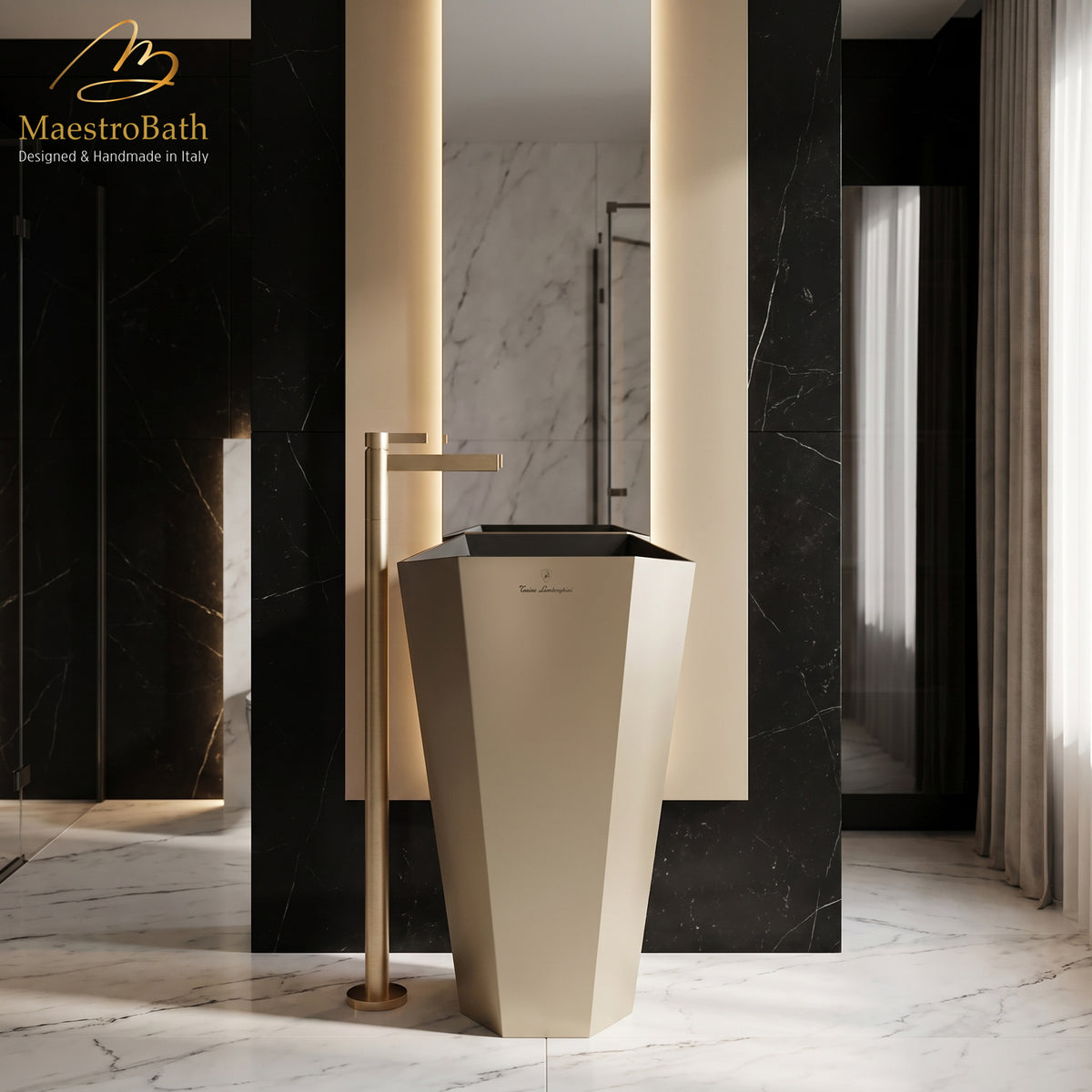 CASO freestanding bathroom faucet in brushed gold, floor mounted beside a faceted pedestal sink in a black and white marble bathroom #color_brushed gold