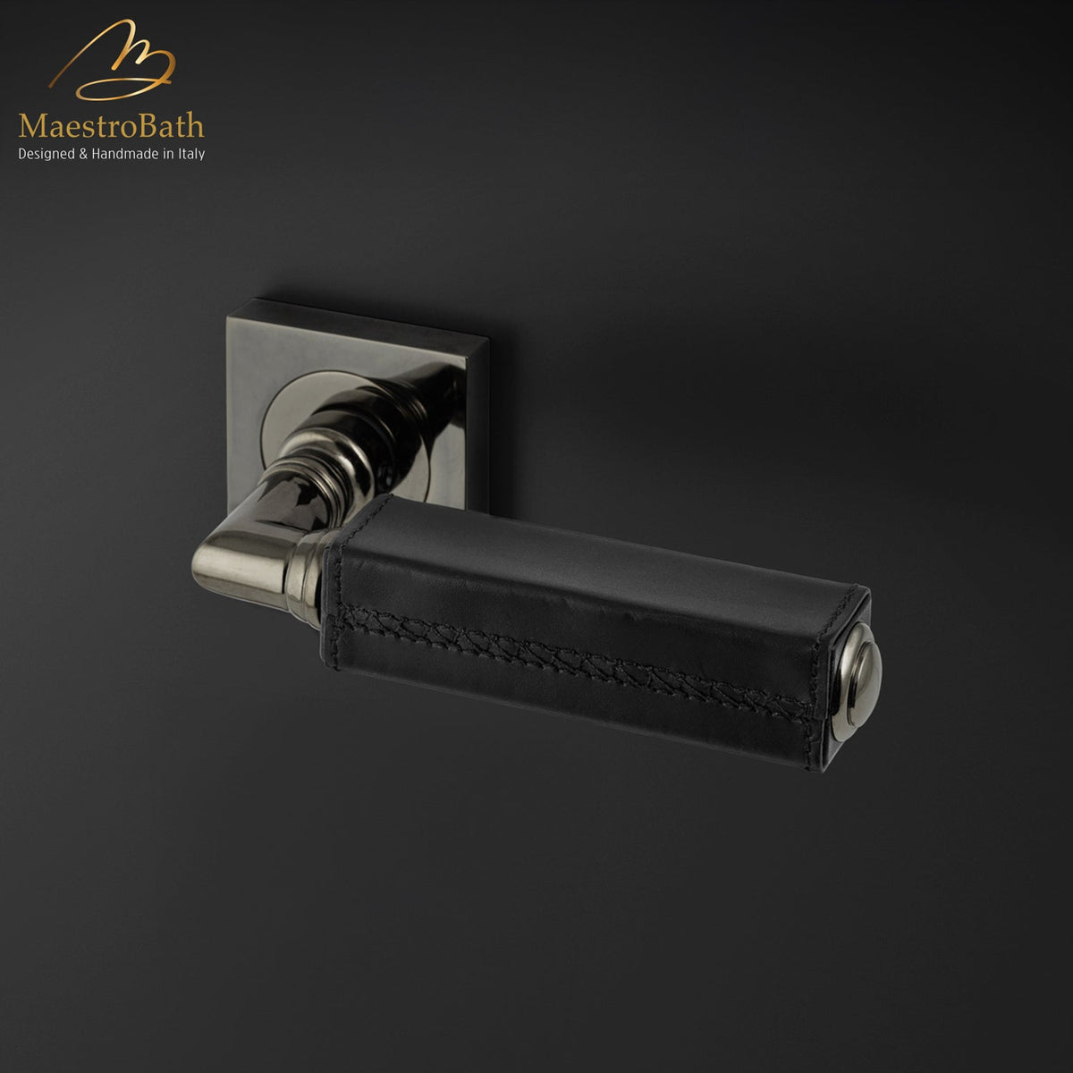 Brass and leather door handle, shown in black and rhutenium, 5.3 inch by 1.9 inch by 2.9 inch