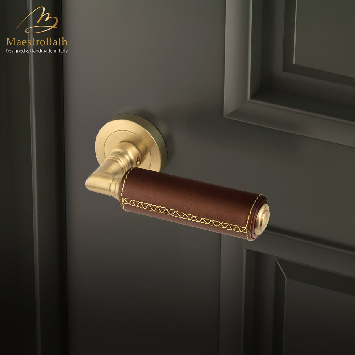 Brass and leather door handle, shown in natural and brushed brass, 5.5 inch by 1.9 inch by 2.5 inch