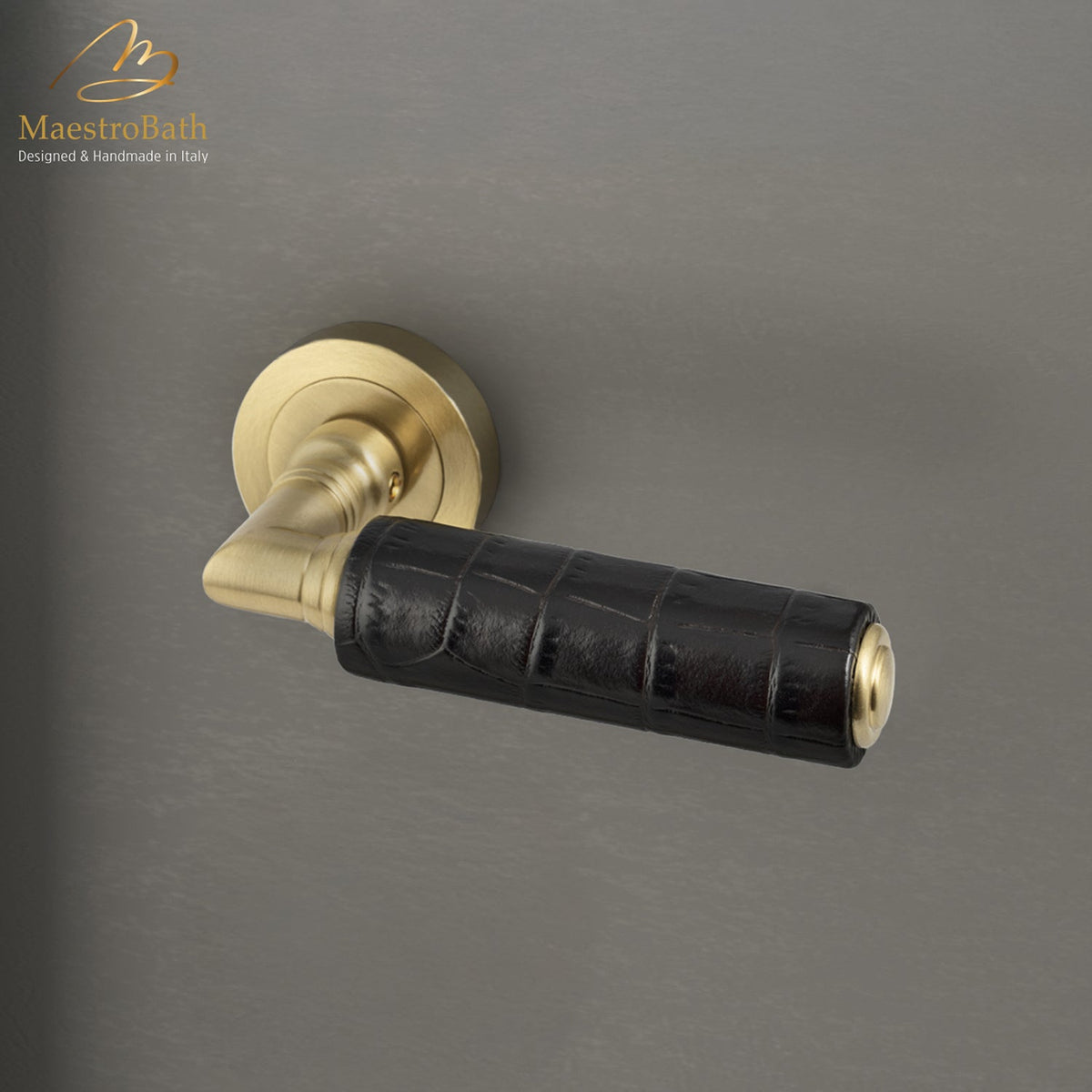 Brass and leather door handle, shown in dark brown and brushed brass, 5.5 inch by 1.9 inch by 2.5 inch