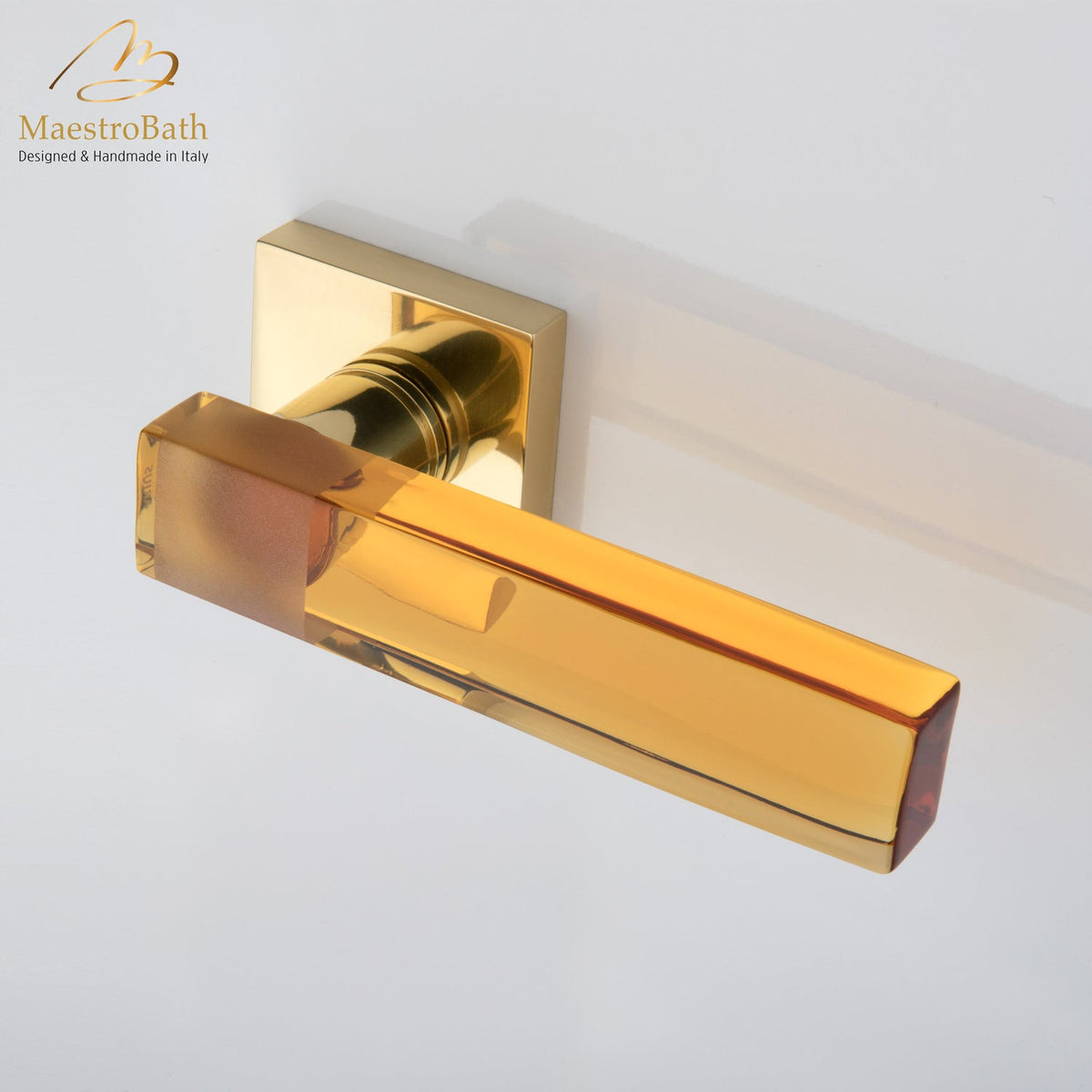 Brass and crystal door handle, shown in amber and polished brass, 5.3 inch by 2 inch by 2 inch