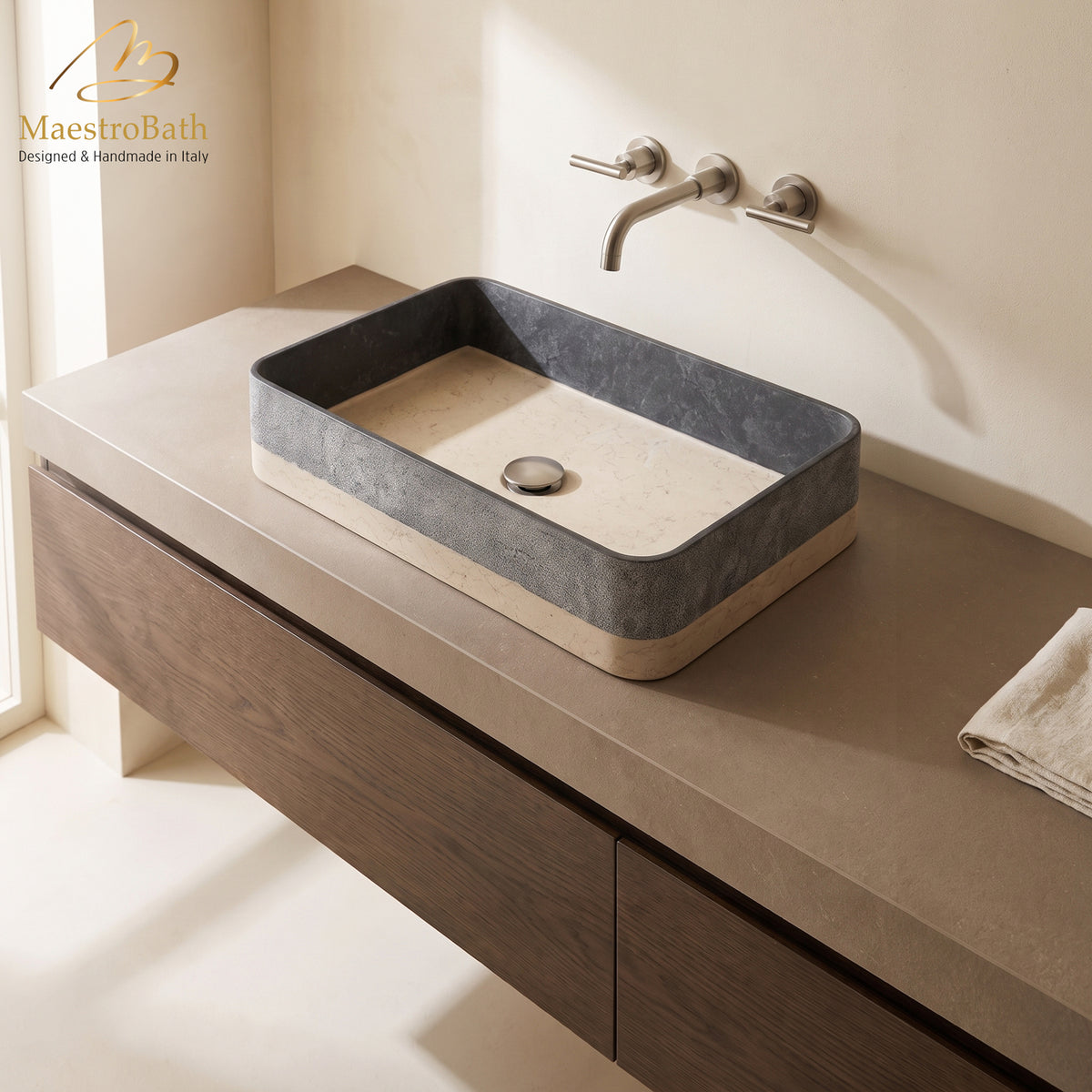 Above counter natural stone vessel sink, shown in black, 24.5 inch by 13.8 inch with a 4.7 inch basin depth