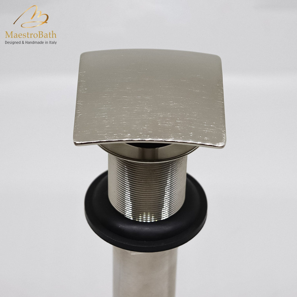 Square brass vessel sink drain, shown in stainless steel, 2.5 inch across and 6 inch deep, made of lead-free brass