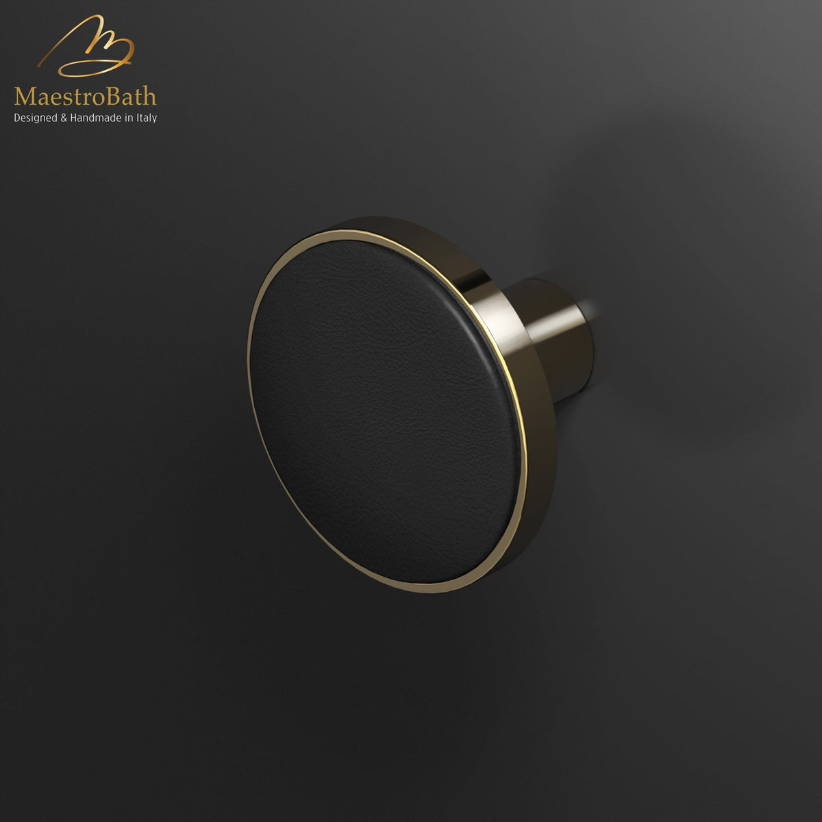Wall mounted leather and brass coat hook, shown in black and polished brass, 2.6 inch by 2.6 inch by 2.1 inch